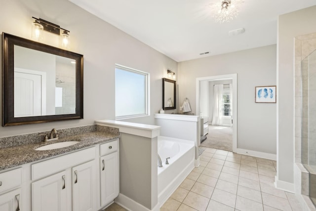 7025 Headwaters Dr, Franklin, TN 37064 - bathroom featuring visible vents, a bath, tile patterned flooring, and vanity