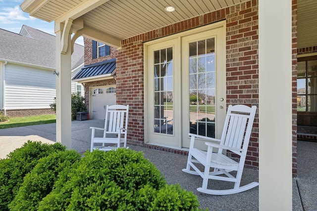 7025 Headwaters Dr, Franklin, TN 37064 - view of patio / terrace featuring a garage