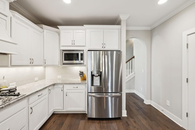 7025 Headwaters Dr, Franklin, TN 37064 - kitchen featuring white cabinets, dark wood-style flooring, and appliances with stainless steel finishes