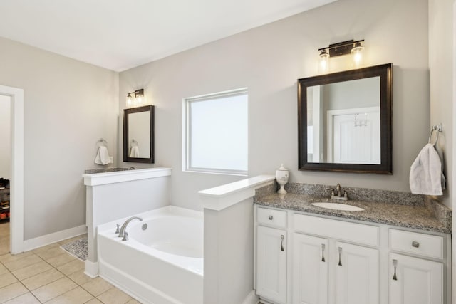 7025 Headwaters Dr, Franklin, TN 37064 - bathroom featuring tile patterned floors, vanity, baseboards, and a garden tub