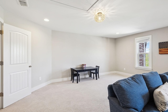 7025 Headwaters Dr, Franklin, TN 37064 - living room featuring light carpet, visible vents, baseboards, and attic access