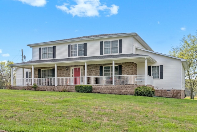 view of front of house featuring brick siding, a front yard, and a porch