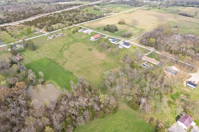 drone / aerial view featuring a rural view and a water view