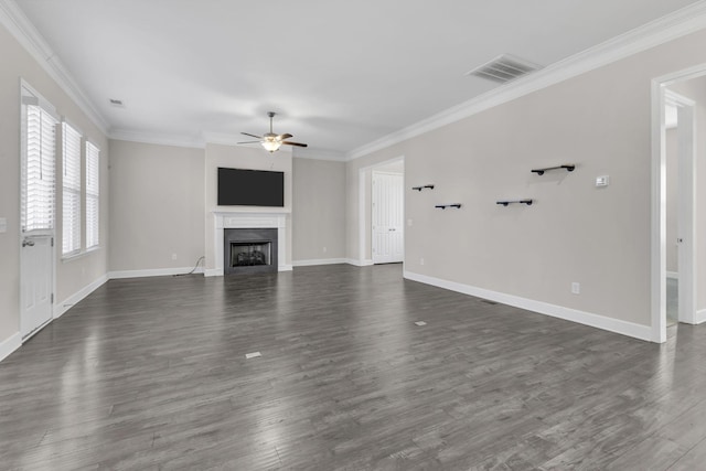 unfurnished living room with visible vents, dark wood finished floors, a ceiling fan, and a fireplace