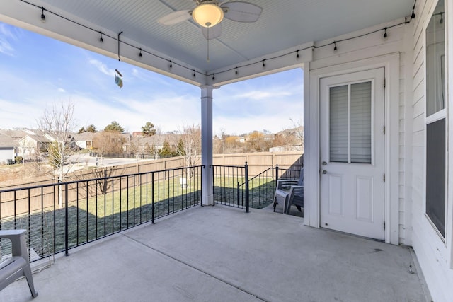 balcony featuring a patio area and ceiling fan