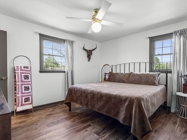bedroom featuring a ceiling fan and wood finished floors