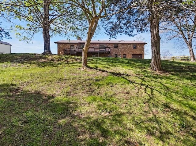 view of yard with a wooden deck