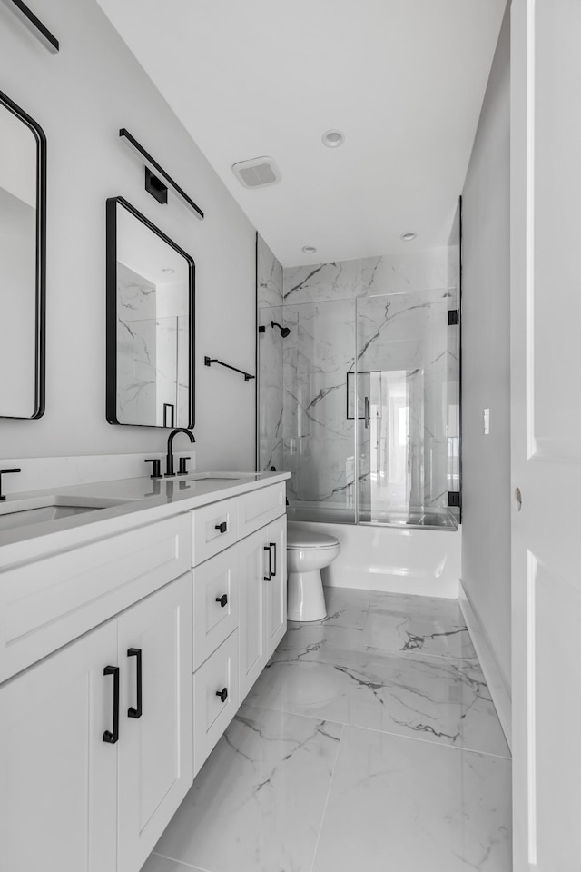 6376D Ivy St, Nashville, TN 37209 - bathroom featuring toilet, marble finish floor, a sink, a marble finish shower, and double vanity