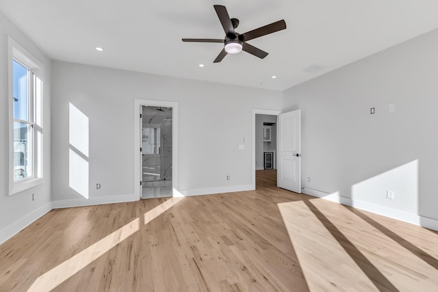 6376D Ivy St, Nashville, TN 37209 - unfurnished bedroom featuring light wood-style floors, baseboards, and multiple windows