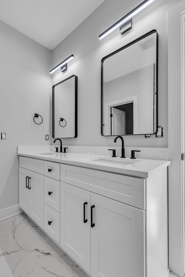 6376D Ivy St, Nashville, TN 37209 - full bathroom featuring double vanity, marble finish floor, and a sink