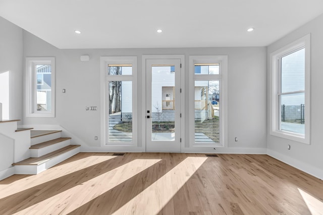 6376D Ivy St, Nashville, TN 37209 - doorway featuring a healthy amount of sunlight, baseboards, and wood finished floors