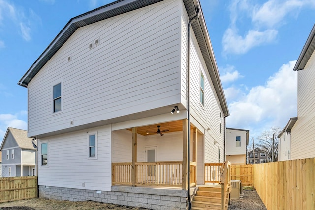 6376D Ivy St, Nashville, TN 37209 - rear view of property with central AC unit, a fenced backyard, and a ceiling fan