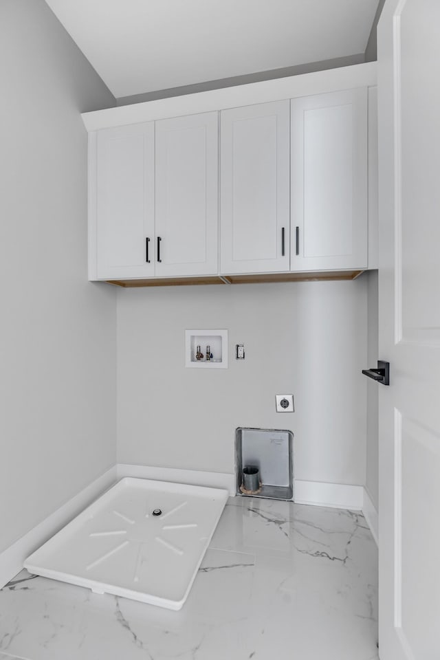 6376D Ivy St, Nashville, TN 37209 - laundry area with hookup for a washing machine, electric dryer hookup, marble finish floor, baseboards, and cabinet space