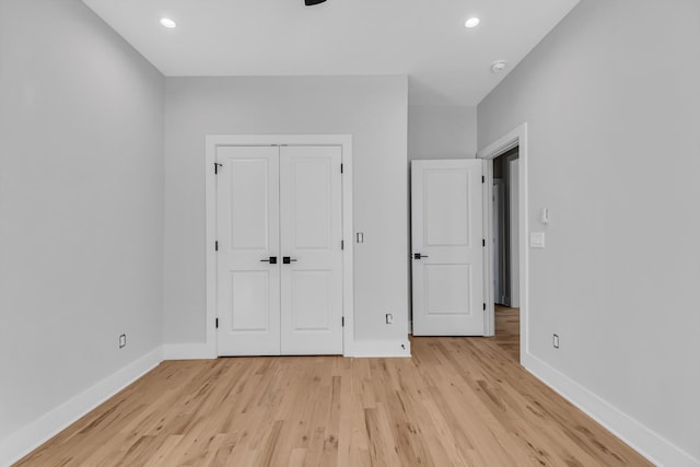 6376D Ivy St, Nashville, TN 37209 - unfurnished bedroom featuring light wood-style flooring, a closet, baseboards, and recessed lighting