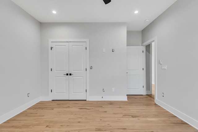 6376D Ivy St, Nashville, TN 37209 - unfurnished bedroom featuring baseboards, light wood finished floors, and recessed lighting
