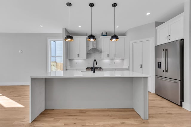6376D Ivy St, Nashville, TN 37209 - kitchen with light wood-style flooring, light countertops, high quality fridge, and white cabinets