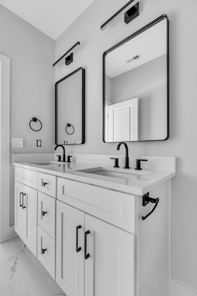 6376D Ivy St, Nashville, TN 37209 - bathroom with double vanity, marble finish floor, a sink, and visible vents