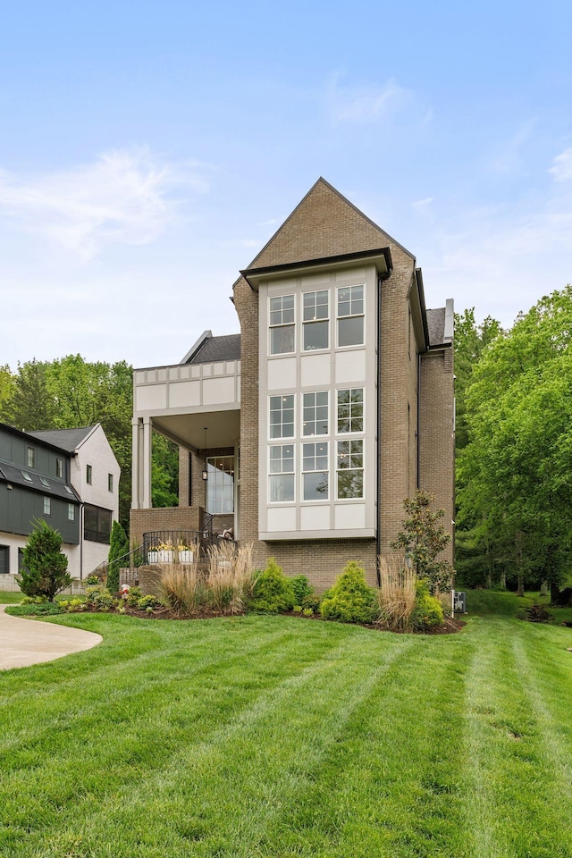 113 Cheekwood Ter, Nashville, TN 37205 - rear view of house featuring brick siding, stucco siding, and a lawn