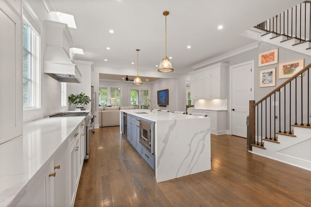 113 Cheekwood Ter, Nashville, TN 37205 - kitchen with a sink, stainless steel appliances, ornamental molding, white cabinets, and open floor plan
