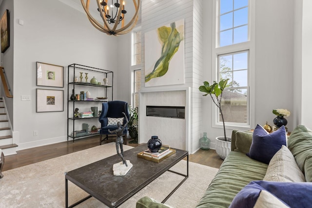 113 Cheekwood Ter, Nashville, TN 37205 - living room with baseboards, wood finished floors, an inviting chandelier, and a towering ceiling