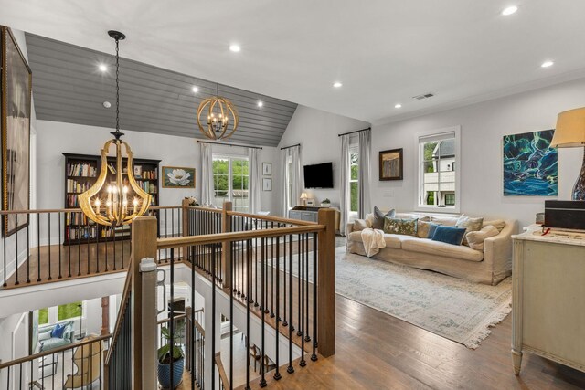 113 Cheekwood Ter, Nashville, TN 37205 - living area featuring an inviting chandelier, wood finished floors, visible vents, and vaulted ceiling