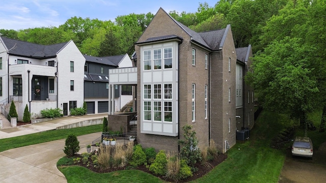113 Cheekwood Ter, Nashville, TN 37205 - view of front of property featuring central AC, brick siding, and stairs