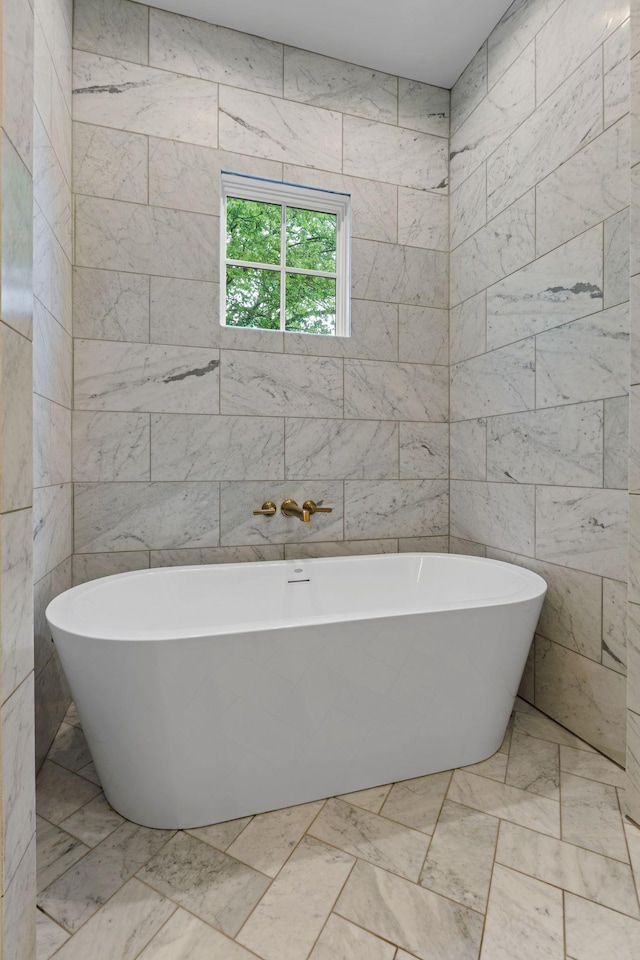 113 Cheekwood Ter, Nashville, TN 37205 - bathroom with a soaking tub, marble finish floor, and tile walls