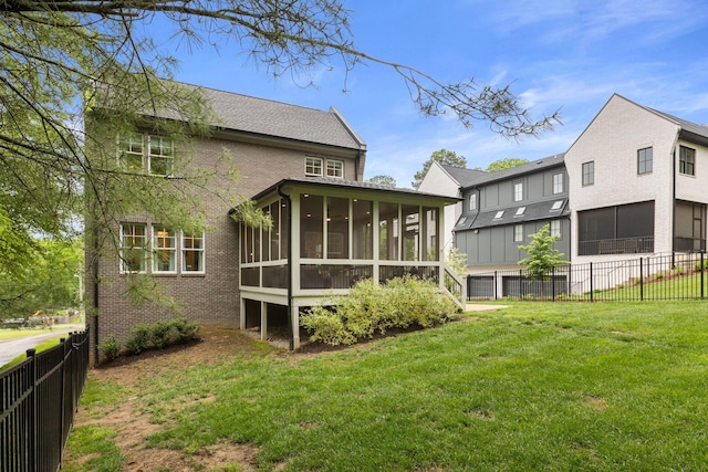 113 Cheekwood Ter, Nashville, TN 37205 - back of house with brick siding, a fenced backyard, a yard, and a sunroom