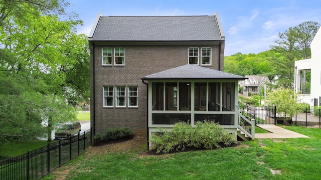 113 Cheekwood Ter, Nashville, TN 37205 - back of house with roof with shingles, a sunroom, a lawn, brick siding, and a fenced backyard