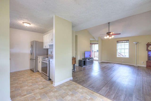 109 Spring Valley Ct, Cross Plains, TN 37049 - kitchen with white cabinets, stainless steel appliances, a ceiling fan, and baseboards