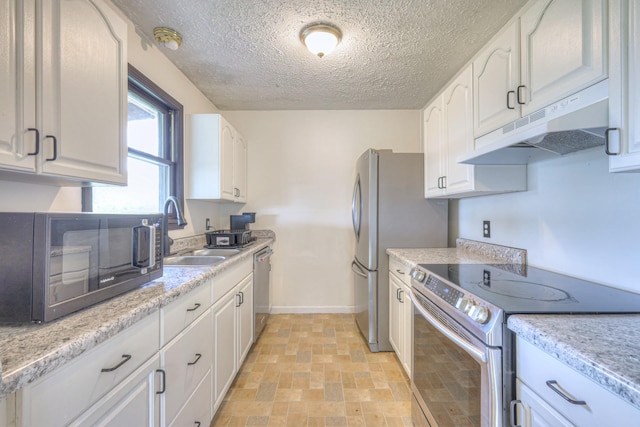109 Spring Valley Ct, Cross Plains, TN 37049 - kitchen with under cabinet range hood, white cabinets, appliances with stainless steel finishes, and a sink