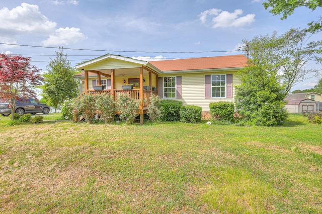 109 Spring Valley Ct, Cross Plains, TN 37049 - ranch-style home featuring a storage shed, a front lawn, and covered porch