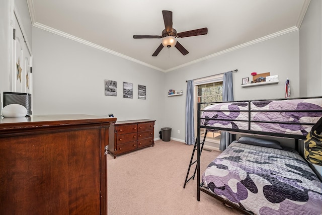 bedroom with crown molding, baseboards, and light colored carpet