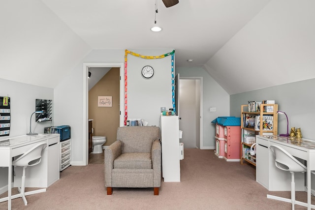 sitting room featuring light colored carpet, vaulted ceiling, and a ceiling fan