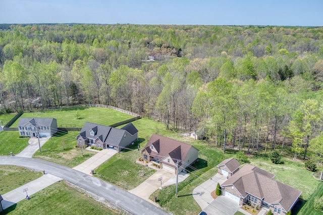 birds eye view of property with a view of trees
