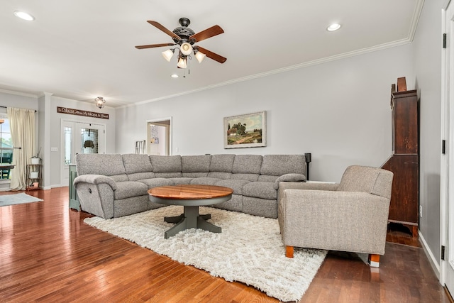 living area featuring recessed lighting, ornamental molding, a ceiling fan, and wood finished floors