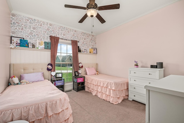 bedroom featuring crown molding, ceiling fan, light colored carpet, and wallpapered walls