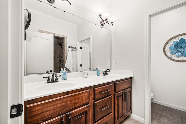 bathroom featuring toilet, crown molding, double vanity, and a sink