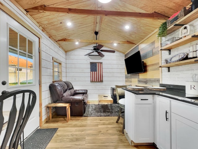 kitchen featuring light wood finished floors, dark countertops, white cabinetry, a ceiling fan, and open shelves