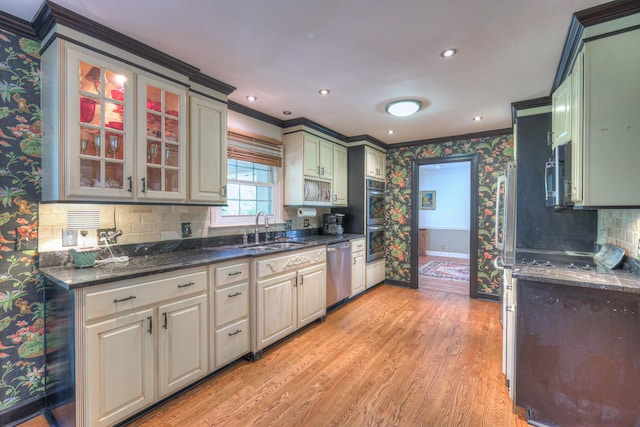 1143 Carnton Ln, Franklin, TN 37064 - kitchen with baseboards, wallpapered walls, crown molding, stainless steel appliances, and a sink