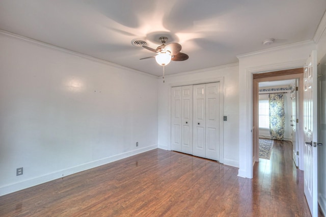 1143 Carnton Ln, Franklin, TN 37064 - unfurnished bedroom featuring dark wood-style flooring, ornamental molding, baseboards, and a closet