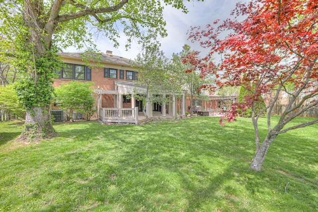 1143 Carnton Ln, Franklin, TN 37064 - back of property with a pergola, a yard, brick siding, a chimney, and a deck