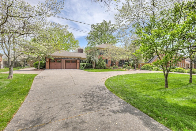 1143 Carnton Ln, Franklin, TN 37064 - tri-level home featuring brick siding, concrete driveway, a garage, and a front yard