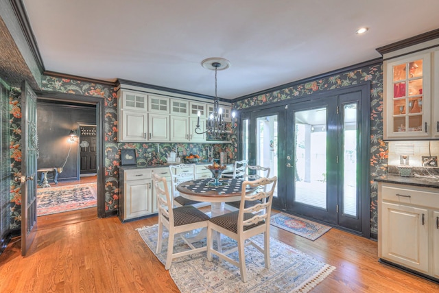 1143 Carnton Ln, Franklin, TN 37064 - dining space featuring light wood-type flooring, wallpapered walls, and ornamental molding