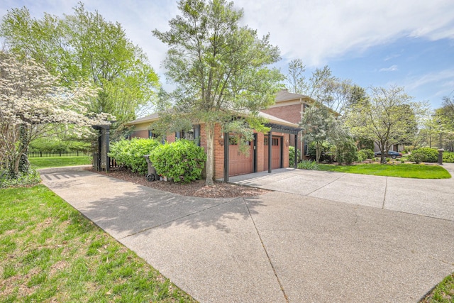 1143 Carnton Ln, Franklin, TN 37064 - view of home's exterior featuring brick siding, an attached garage, and concrete driveway
