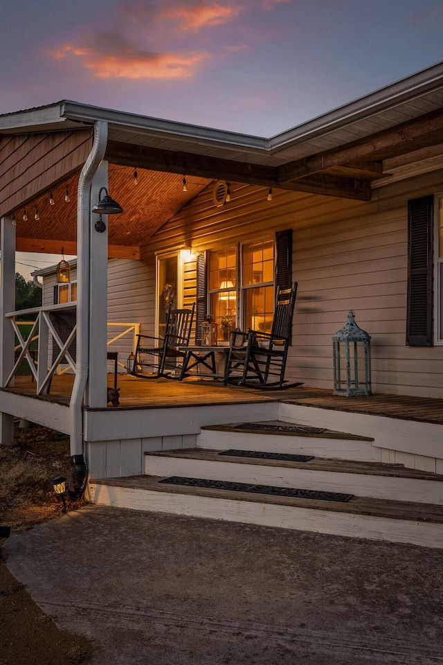 exterior entry at dusk with a porch