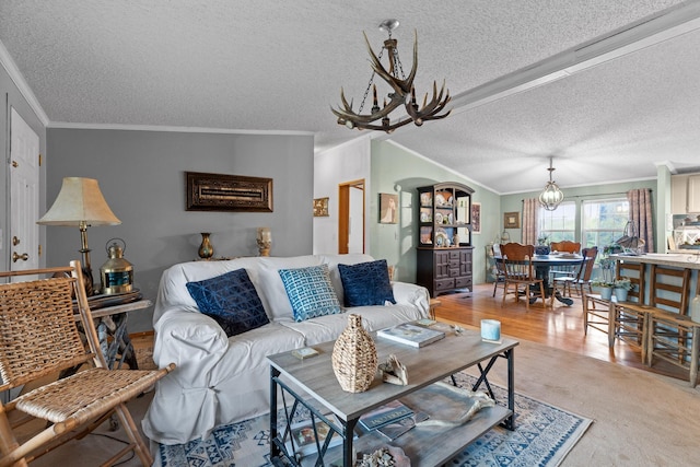 living room featuring a chandelier, crown molding, and a textured ceiling