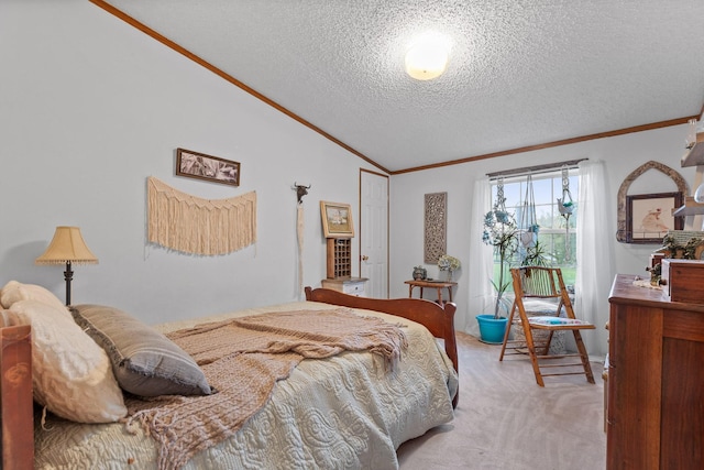 bedroom with vaulted ceiling, light colored carpet, ornamental molding, and a textured ceiling