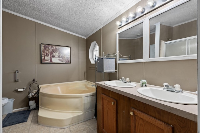 bathroom featuring a bath, a textured ceiling, a sink, and a stall shower