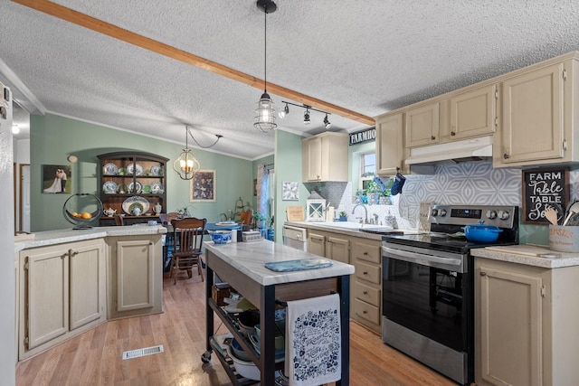 kitchen with visible vents, dishwasher, a textured ceiling, under cabinet range hood, and electric range